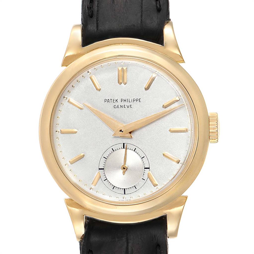 This image shows a frontal view of a Patek Philippe Calatrava 1491 Men's Yellow Gold Silver Dial 1491 Men's Yellow Gold Silver Dial watch, highlighting its dial, hands, and leather strap.