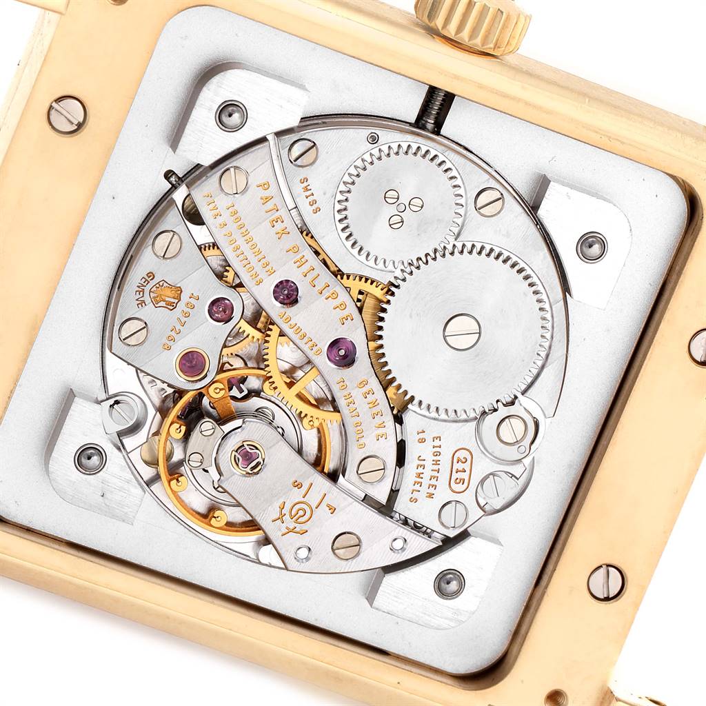 The image shows the intricate internal mechanisms of the Patek Philippe Gondolo 51111J Men's Yellow Gold Silver Dial 51111J Men's Yellow Gold Silver Dial watch, viewed from the back.