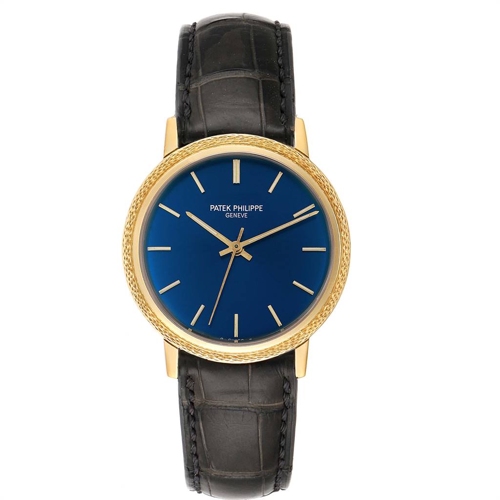 The image shows a frontal view of a vintage Patek Philippe watch with a blue dial, gold case, and black leather strap.