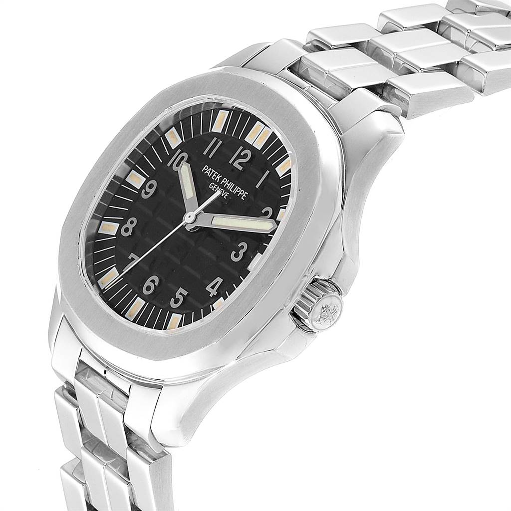 The image shows a Patek Philippe Aquanaut 5065/1A-010 Men's Stainless Steel Black Dial 5065/1A-010 Men's Stainless Steel Black Dial watch at a three-quarter angle, highlighting the dial, bezel, crown, and bracelet.