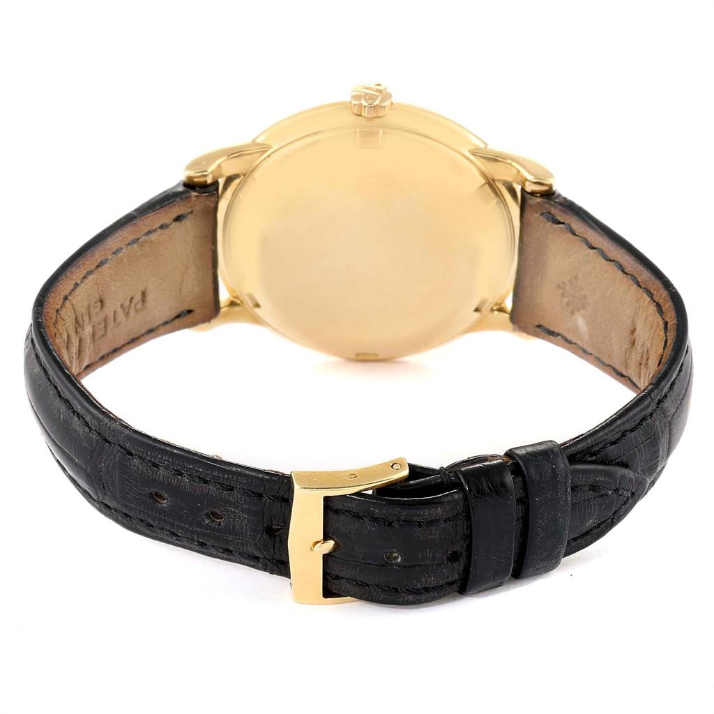 This image shows the back view of the Vintage Patek Philippe watch, highlighting its leather strap and gold case.