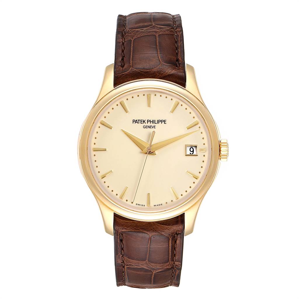 The Patek Philippe Calatrava 5227 Men's Yellow Gold Beige Dial 5227 Men's Yellow Gold Beige Dial watch is shown from a top-down angle, featuring its face, bezel, crown, and leather strap.