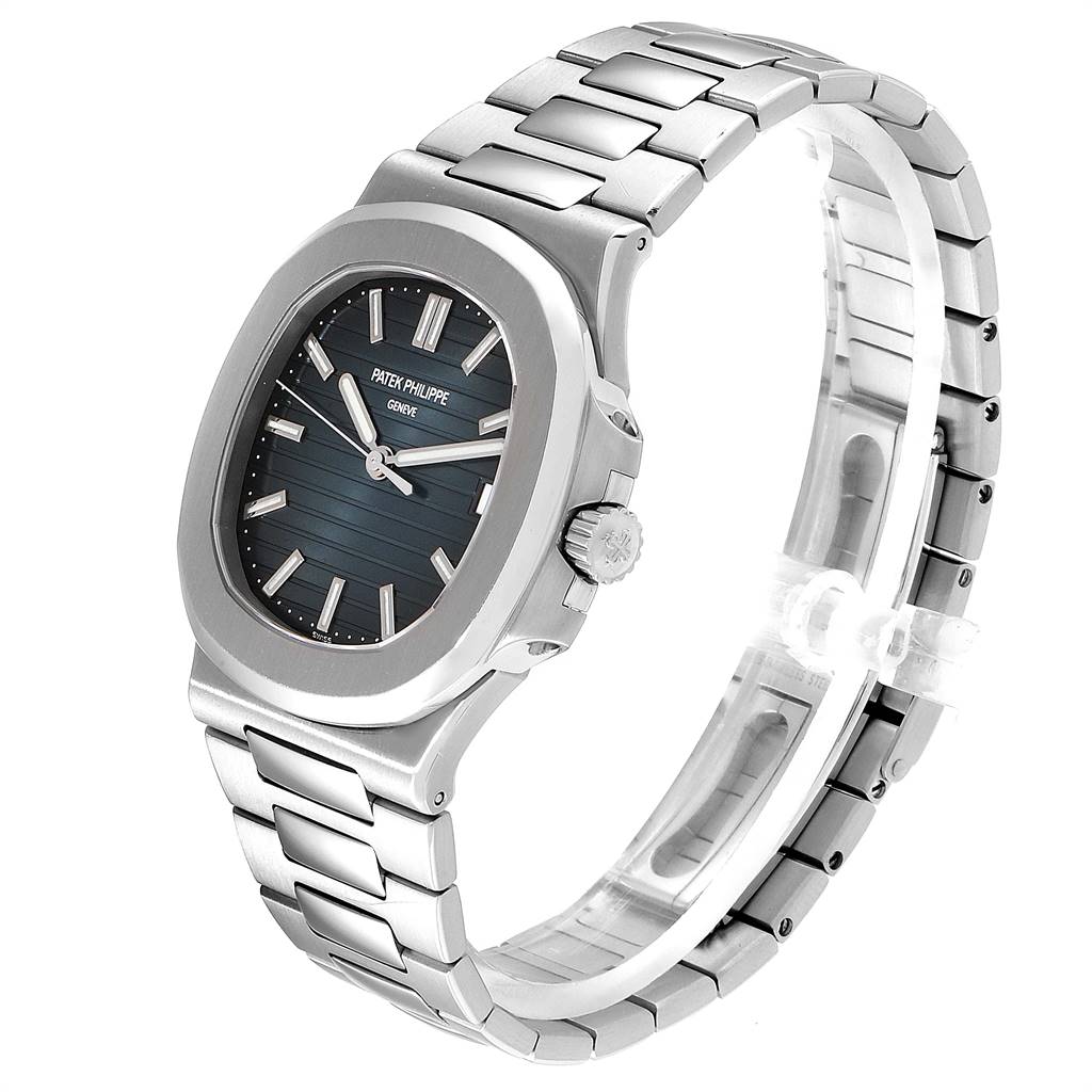 The image shows a side angle of a Patek Philippe Nautilus 5711/1A-010 Men's Stainless Steel Blue Dial 5711/1A-010 Men's Stainless Steel Blue Dial watch, highlighting its dial, bezel, crown, and bracelet.