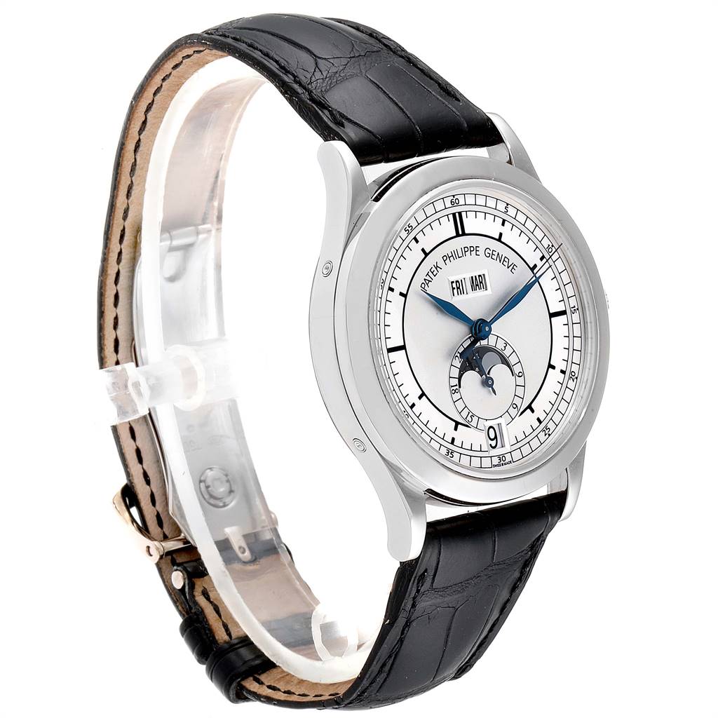 The image shows a Patek Philippe Complications 5396G-001 Men's White Gold Silver Dial 5396G-001 Men's White Gold Silver Dial watch at a three-quarter angle, highlighting its face, bezel, and black leather strap.