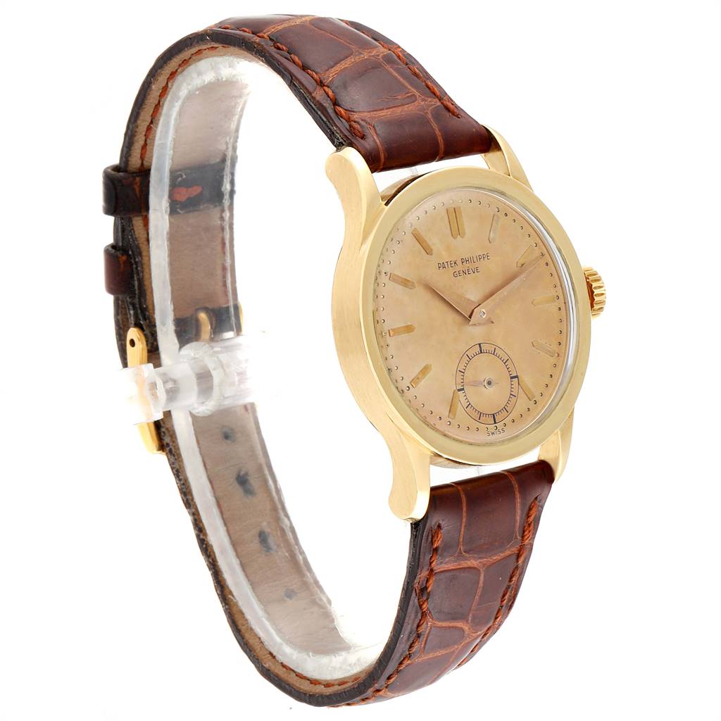 This image shows a side view of the Vintage Patek Philippe watch, highlighting its dial, case, and leather strap.