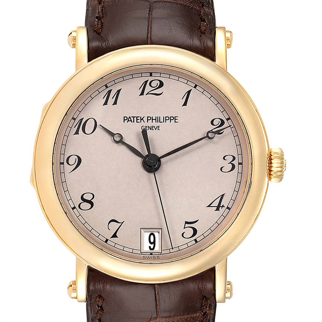 This image shows a front view of a Patek Philippe Calatrava 5053 Men
s Yellow Gold Beige Dial 5053 Men
s Yellow Gold Beige Dial watch featuring its face, hands, crown, and date window.