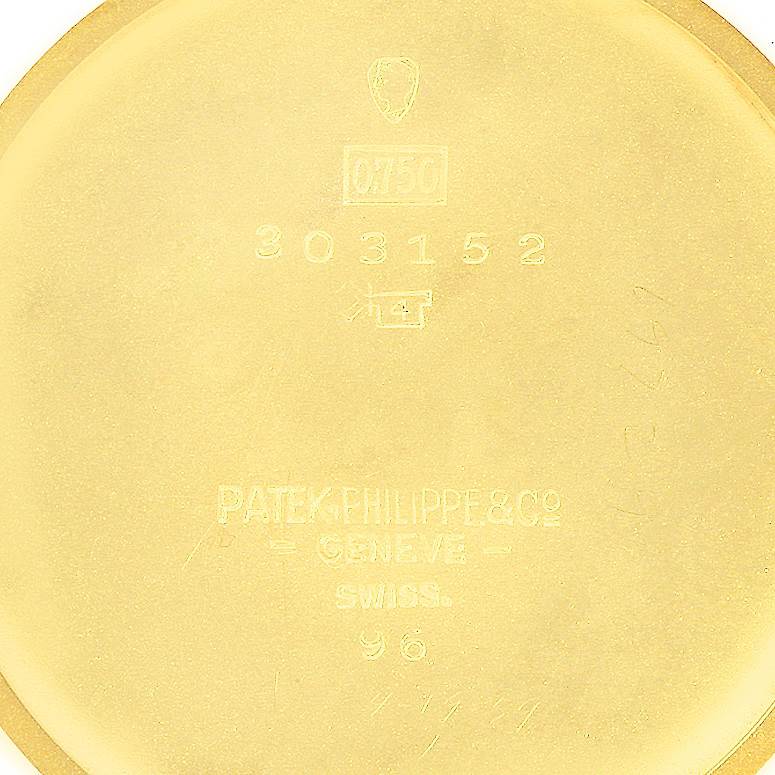 This close-up image shows the inside of the case back of a Vintage Patek Philippe model 96 watch.