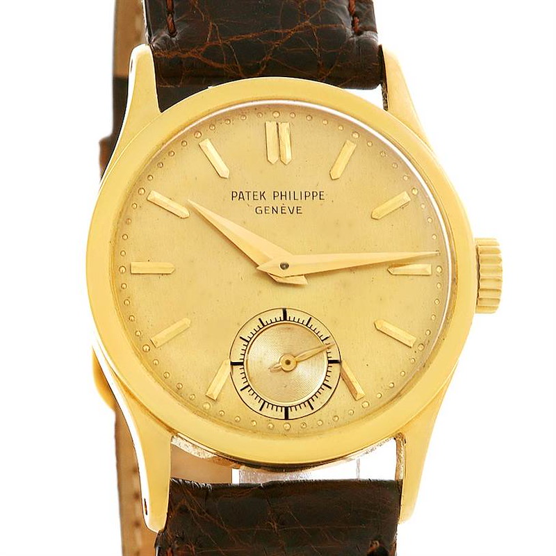 This vintage Patek Philippe watch is shown from the front, displaying the dial, hands, markers, and a leather strap.