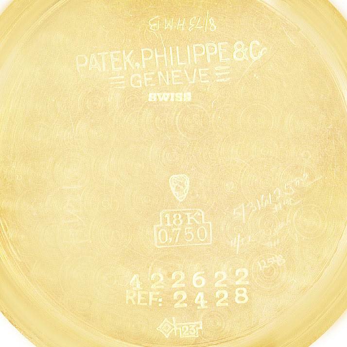 This image shows the inside case back of a Vintage Patek Philippe watch, model reference 2428, indicating it is made of 18K gold.