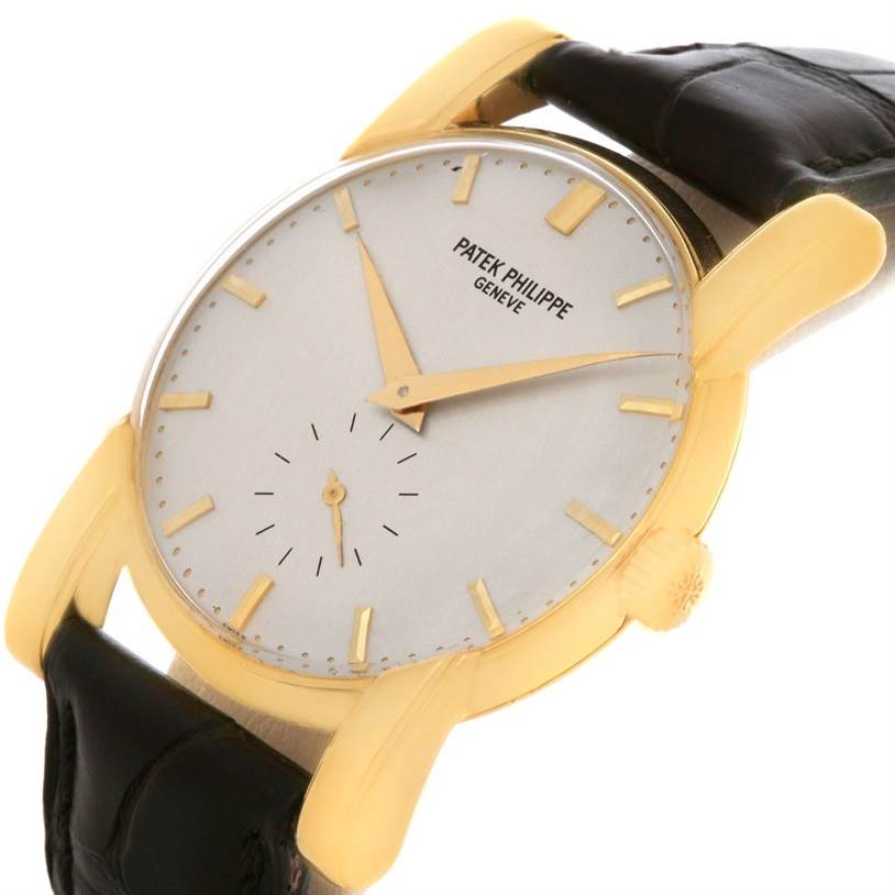 This image shows a Patek Philippe Vintage watch at a slight angle, displaying its face, hands, crown, and part of the black leather strap.