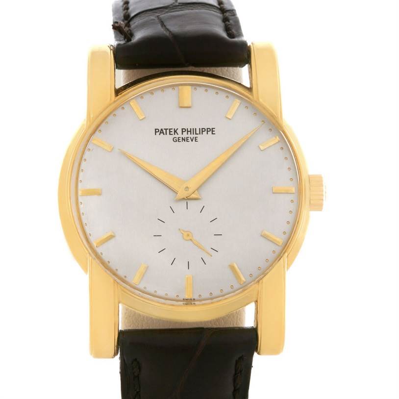 The image shows a front view of a Vintage Patek Philippe watch, displaying its dial, hands, and leather strap.