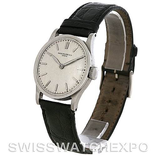 The image shows a Patek Philippe Vintage watch from a front-left angle, displaying the watch face and black leather strap.