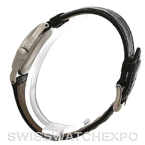 This side view features the casing, crown, and leather strap of a Vintage Patek Philippe watch.