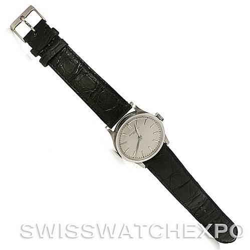 The image shows a full view from above of a Patek Philippe Vintage model watch, displaying the face, case, and black leather strap.
