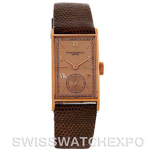 This image features a frontal view of a Vintage Patek Philippe watch with a rectangular face and brown leather strap.