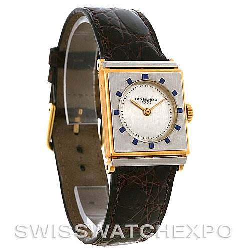 The image shows a Vintage Patek Philippe watch at a three-quarter angle, displaying its square face, strap, and dial.