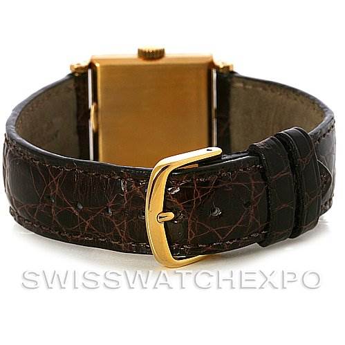 This image shows the back and buckle of a Vintage Patek Philippe watch, highlighting its leather strap and gold clasp.