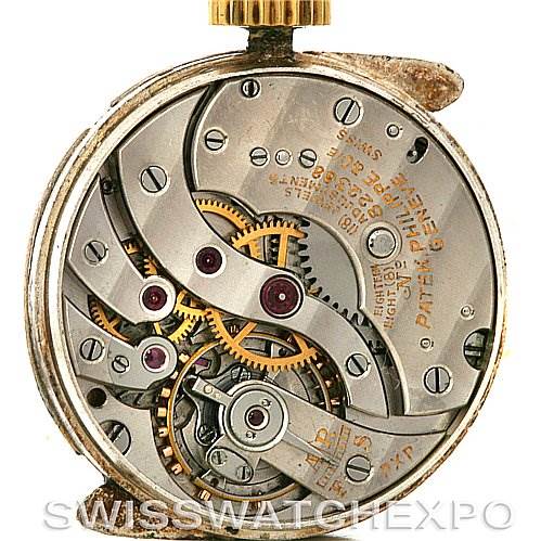 This image shows the intricate movement and internal components of a Vintage Patek Philippe watch from a back angle.
