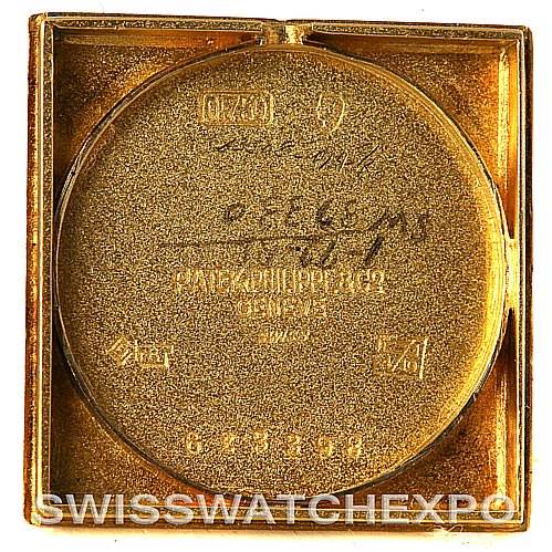 The image shows the back cover of a Vintage Patek Philippe watch, highlighting inscriptions and serial numbers.