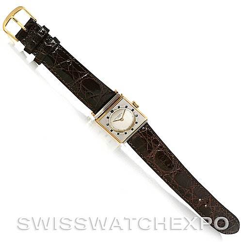 The image shows a top-down view of a Vintage Patek Philippe watch with a square gold case and dark brown leather strap.