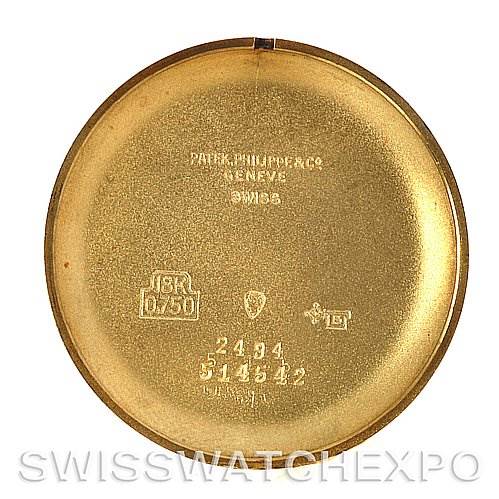 The image shows the inner case back of a Vintage Patek Philippe watch, featuring engraved markings and numbers.