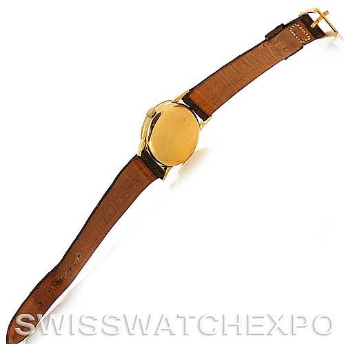 This image shows the back and the leather strap of a Vintage Patek Philippe watch from a top-down angle.