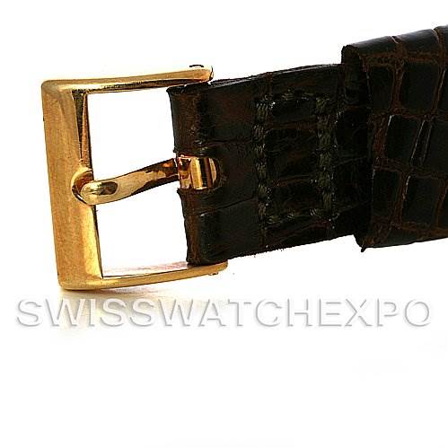 The image shows a close-up of the clasp and leather strap of a vintage Patek Philippe watch.
