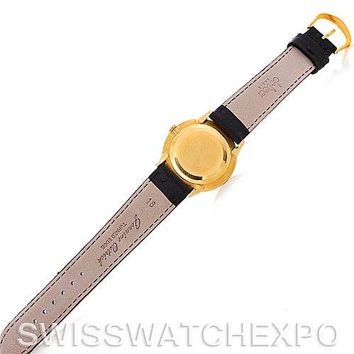 The image shows the back view of a Patek Philippe Vintage model watch, highlighting its leather strap and gold case back.