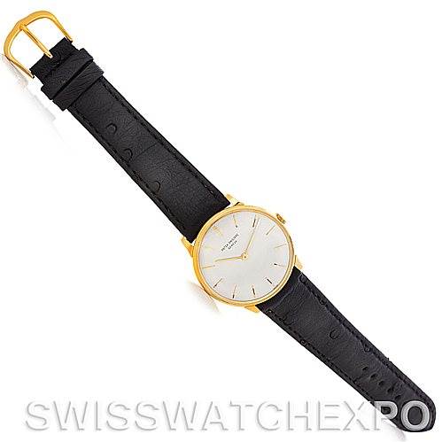 The image shows a top-down view of a Patek Philippe Vintage watch featuring the watch face, strap, and buckle.