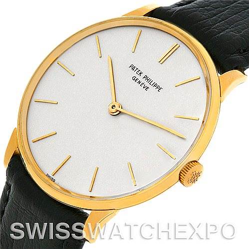 The image shows a Patek Philippe Vintage model watch from a slightly angled side, highlighting the face, bezel, and crown.