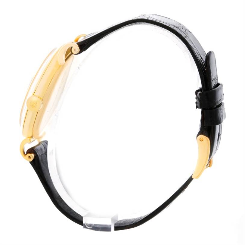 Side view of the Vintage Patek Philippe watch, showing the crown, case, and leather strap.