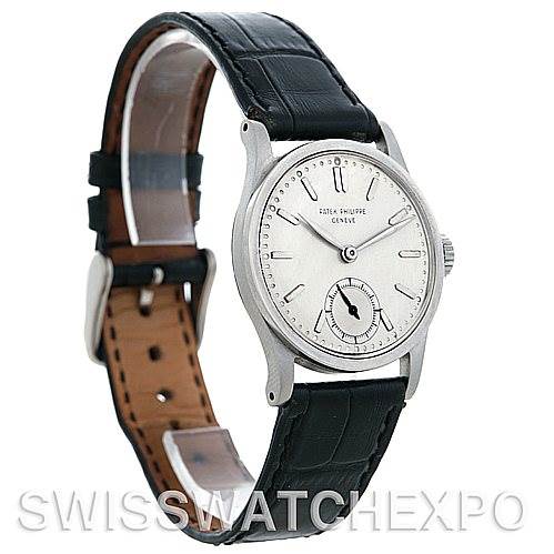 The image shows a side angle of the Patek Philippe Vintage model watch, highlighting the dial, face, case, and leather strap.