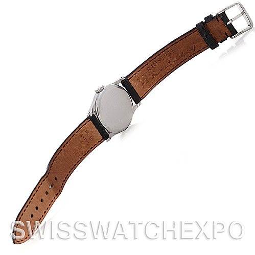 The image shows the back view of a Vintage Patek Philippe watch, highlighting the leather strap, buckle, and case back.