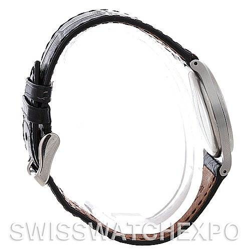 The image shows a side angle of a vintage Patek Philippe watch, highlighting the case and leather strap with buckle.