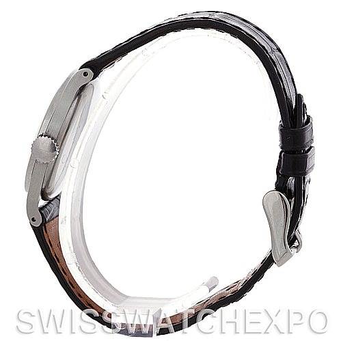 This is a side view of a Vintage Patek Philippe watch, displaying its crown, case, leather strap, and buckle.