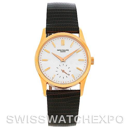 The image shows a front view of a Vintage Patek Philippe watch with a gold case and a black leather strap.