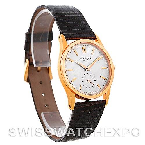 This image shows a side and front angle of a Vintage Patek Philippe watch with a gold case and black leather strap.