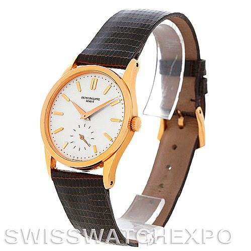 This image shows a side and partial front view of a Vintage Patek Philippe watch with a leather strap.