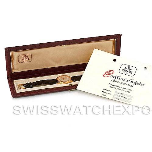 The image shows a Patek Philippe Vintage watch in its case, along with its certificate of origin.