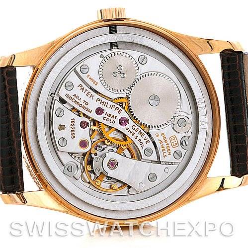 This image shows the back of a Patek Philippe Vintage watch, displaying the intricate inner mechanisms.