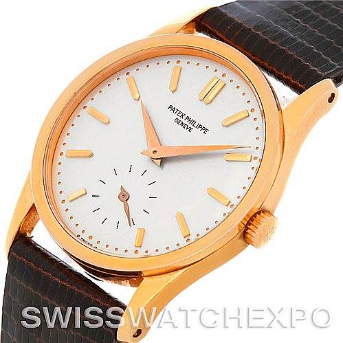 The image shows a Patek Philippe Vintage watch at an angle, highlighting its face, bezel, crown, and a portion of the strap.