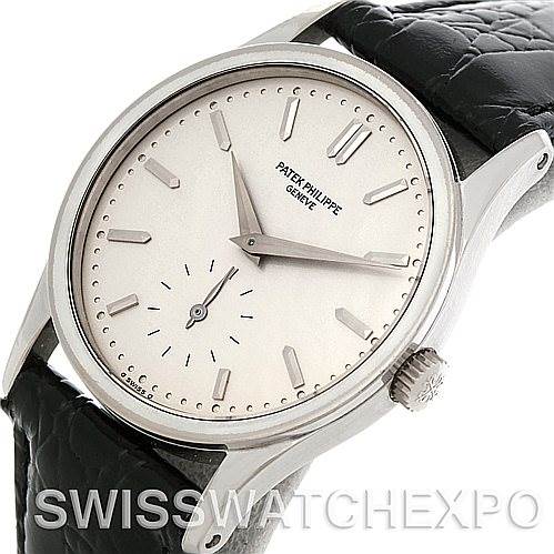The image shows a Vintage Patek Philippe watch at a slight angle, displaying the dial, hour markers, hands, crown, and leather strap.