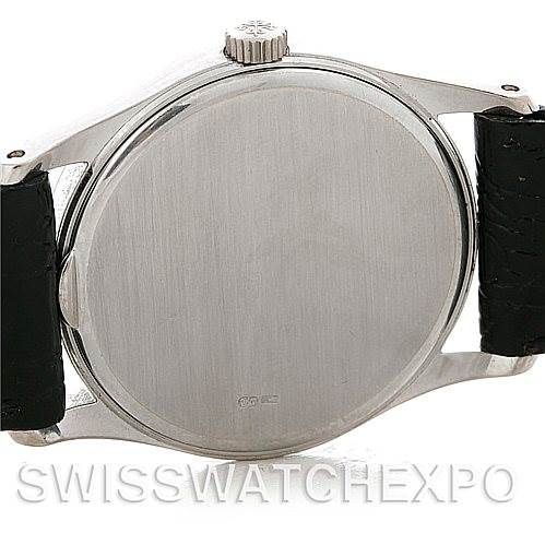 Rear view of a Vintage Patek Philippe watch showing the case back, lugs, and crown, with black leather straps attached.