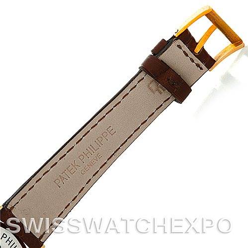 The image shows a brown leather watch strap and gold buckle from a Vintage model by Patek Philippe from the back.