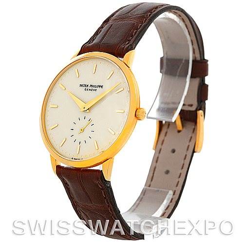 The image shows a Vintage Patek Philippe watch angled to display the face, crown, and leather strap, with the front and part of the side visible.