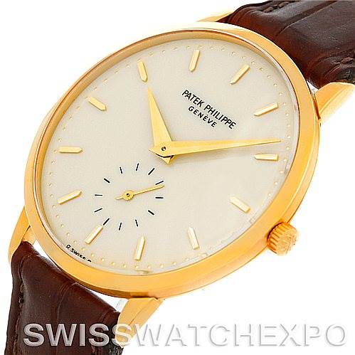 The image shows a Patek Philippe Vintage 3893 Men's Yellow Gold Champagne Dial 3893 Men's Yellow Gold Champagne Dial watch at an oblique angle, highlighting the face, hands, crown, and leather strap.