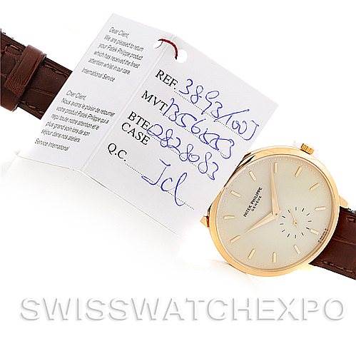 The image shows a Patek Philippe Vintage 3893 Men's Yellow Gold Champagne Dial 3893 Men's Yellow Gold Champagne Dial watch model with its face, brown leather strap, and a tagged certification card.