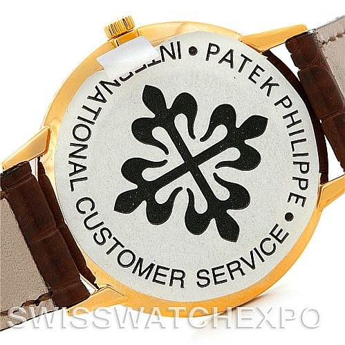 The image shows the back case and leather straps of a Vintage Patek Philippe watch.