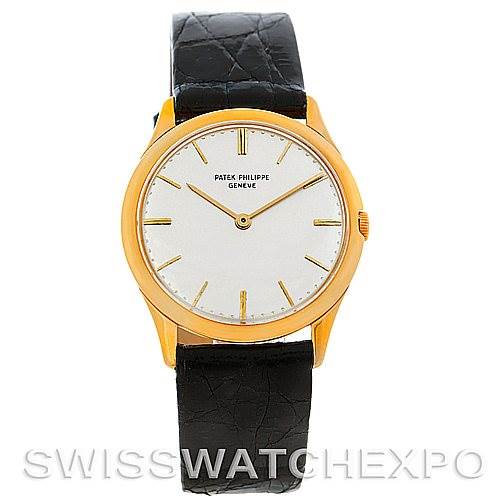 The image shows a front view of a Vintage Patek Philippe watch with a gold case and a black leather strap.