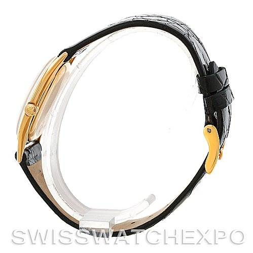 The image shows a side profile of a Vintage Patek Philippe watch, highlighting the crown, case profile, and leather strap.